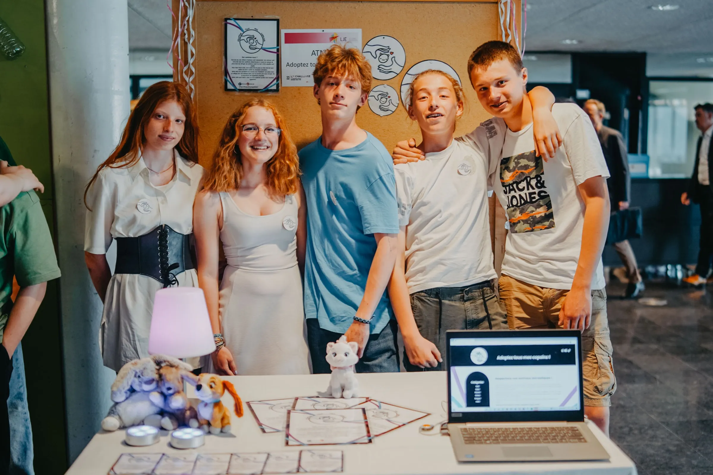 A team of pupils behind the stand they built for their project.